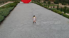 Making circles around a runner in the park