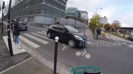 Pedestrians nearly hit by a car after not having respected the traffic light. Paris suburb, Ivry-sur-Seine. 24nov19
