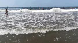 Boys Brave Enough To Swim Against Big Waves