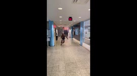 Skilled 5 foot 6 US athlete leaps and kicks 8-foot-high exit sign