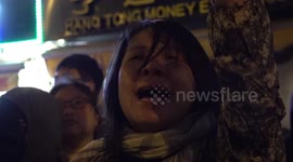 Protester cries as she chants outside Hong Kong's Polytechnic University