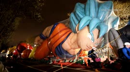 Thousands queue to watch the inflation of the balloons for the Macy's Thanksgiving Day Parade