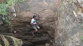 Man risks life using makeshift harness to save drowning peacock from 30ft well in snake-infested southern Indian farm