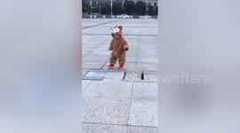 Chinese toddler finally overcomes fears and walks across drain