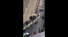 Police remove injured from London Bridge after deadly attack