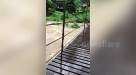 Water gushes down swollen river after heavy rain in southern Thailand