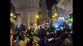 Riot police arrest female protester as officers struggle to disperse anti-government protesters at rally outside Prince Edward MTR station in Hong Kong