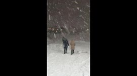 The bad weather can't stop this two ladies to shop at black friday