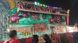 Terrifying moment people are thrown from fairground ride when safety bar opens