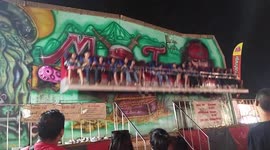 Terrifying moment people are thrown from Thailand fairground ride when safety bar opens