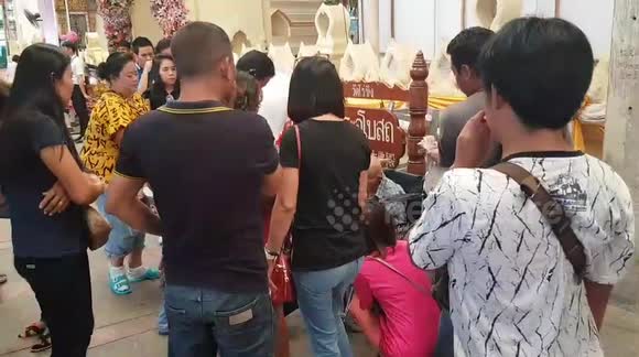 This former beggar, now wheel-chair bound lottery seller, donates millions to temple in Thailand