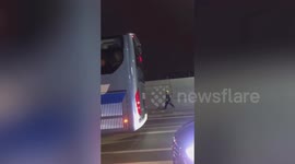 Chinese construction worker joyfully skips on his way home