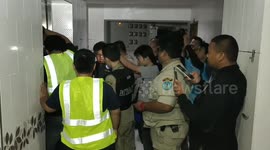 Thai teenager climbs through jammed doors after getting stuck in a lift