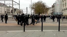 Policeman throws woman to the ground as protests against retirement reform paralyse France