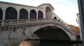 The Rialto Bridge: the oldest of the four bridges in the Grand Canal in Venice, Italy, at 7 am.