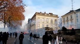 Tear gas fired as protesters pass by the prefecture