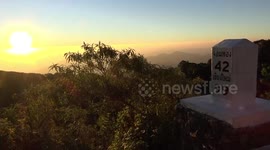 Tourists gather on mountain where temperatures are below freezing in Northern Thailand