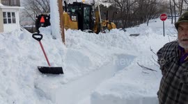 US neighbours look on in disbelief as truck pushes snow back onto sidewalk they spent 20-minutes clearing