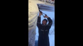 Scraping snow off the house