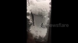 This footage of an Icelandic man navigating his house encased in snow after a blizzard is wild