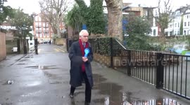 A voter wearing a light blue rosette spotted outside South Bolton Gardens polling station in London