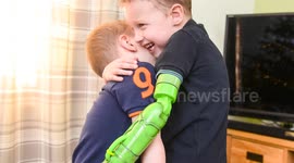 Five-year-old boy can finally give his little brother a hug after being the first child in the UK to have a functioning prosthetic arm fixed ABOVE the elbow