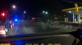 Reckless driver gets caught by police jumping red light on London road