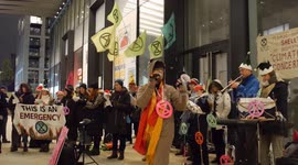 Eco-themed Christmas carols sung by climate activists outside Shell's London HQ