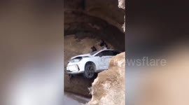 Three injured after car falls into construction site hole in southern China