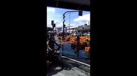 Locals loots dozens of bottles of fizzy pop which spilled from lorry