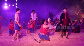 Locals stage dramatic sword fight at rural festival in Thailand