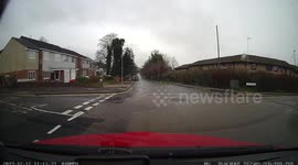 learner makes a mistake on a mock test turning right and almost hits a grass verge and pavement with instructor stopping the car