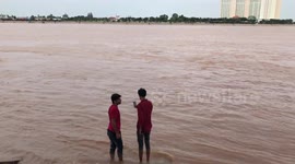 Tourists Wash Their Feet In Mekong River