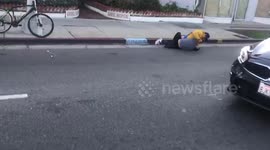 Man in car fights with guy on bike on Melrose ave