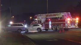 Fire rescue and tow trucks deal with two car crash at night in Richmond Hill near Toronto