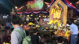 Worshippers whisper New Year Wishes into mouse's ear in Thailand