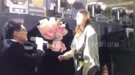 Chinese woman faints after boyfriend's surprise concert proposal