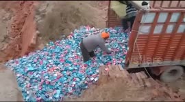 Mystery trucks caught dumping thousands of unopened condoms in vacant land in north India