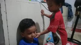 kids 2 years old massage his brother being sick