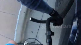 'Enjoy your dent': Shocking moment driver brake checks US cyclist sending them over the handlebars