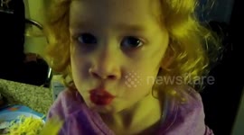 Three year old girl tries baby sweetcorn for the first time