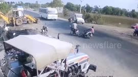 Shocking crash see motorcycle rider miraculously survive being run over by a bus in India
