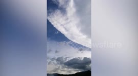 Ash cloud suspended in sky from Taal volcano