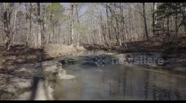 Drone flying over creek