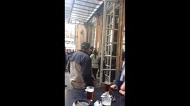 Fight outside pub in London