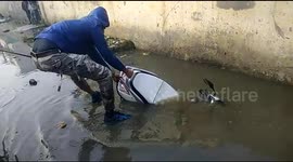Two girls riding scooter in north India plunge into drainage ditch and nearly drown