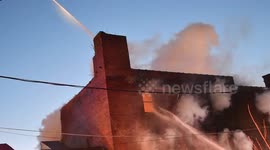 Pennsylvania firefighters attack burning factory in frigid conditions