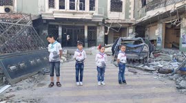 Children dance in front of a hospital destroyed by the Assad forces in Kafr Nabl city in Idlib countryside, and they demand peace and freedom in the history of 10_7_2019