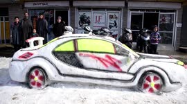 Boy makes impressive sports car out of snow in northern India