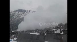 Huge avalanche hurtles down slope near village in northern India